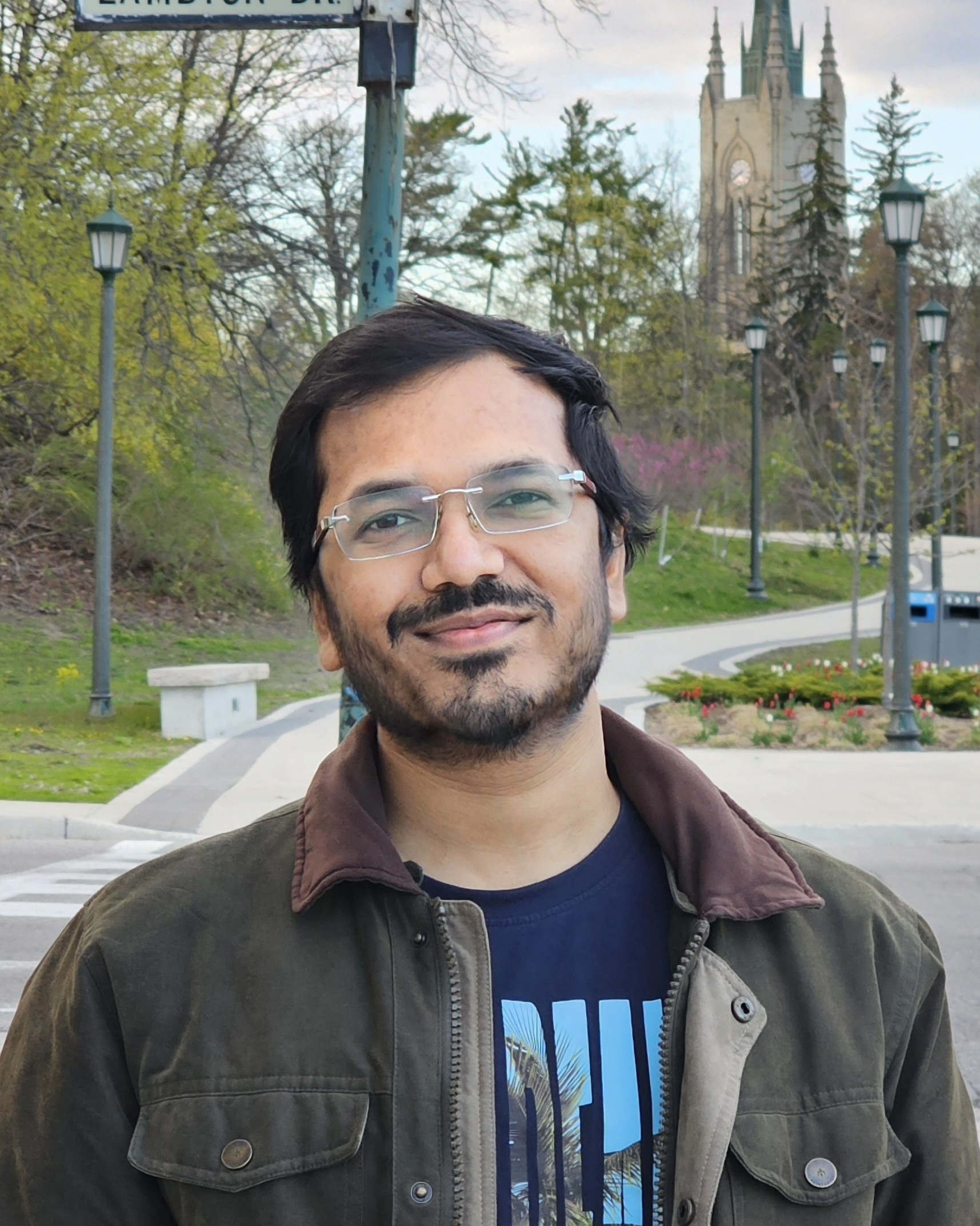 Aditya Nayak, PhD Student at the School of Computing and Information, University of Pittsburgh, standing outdoors near a university building.